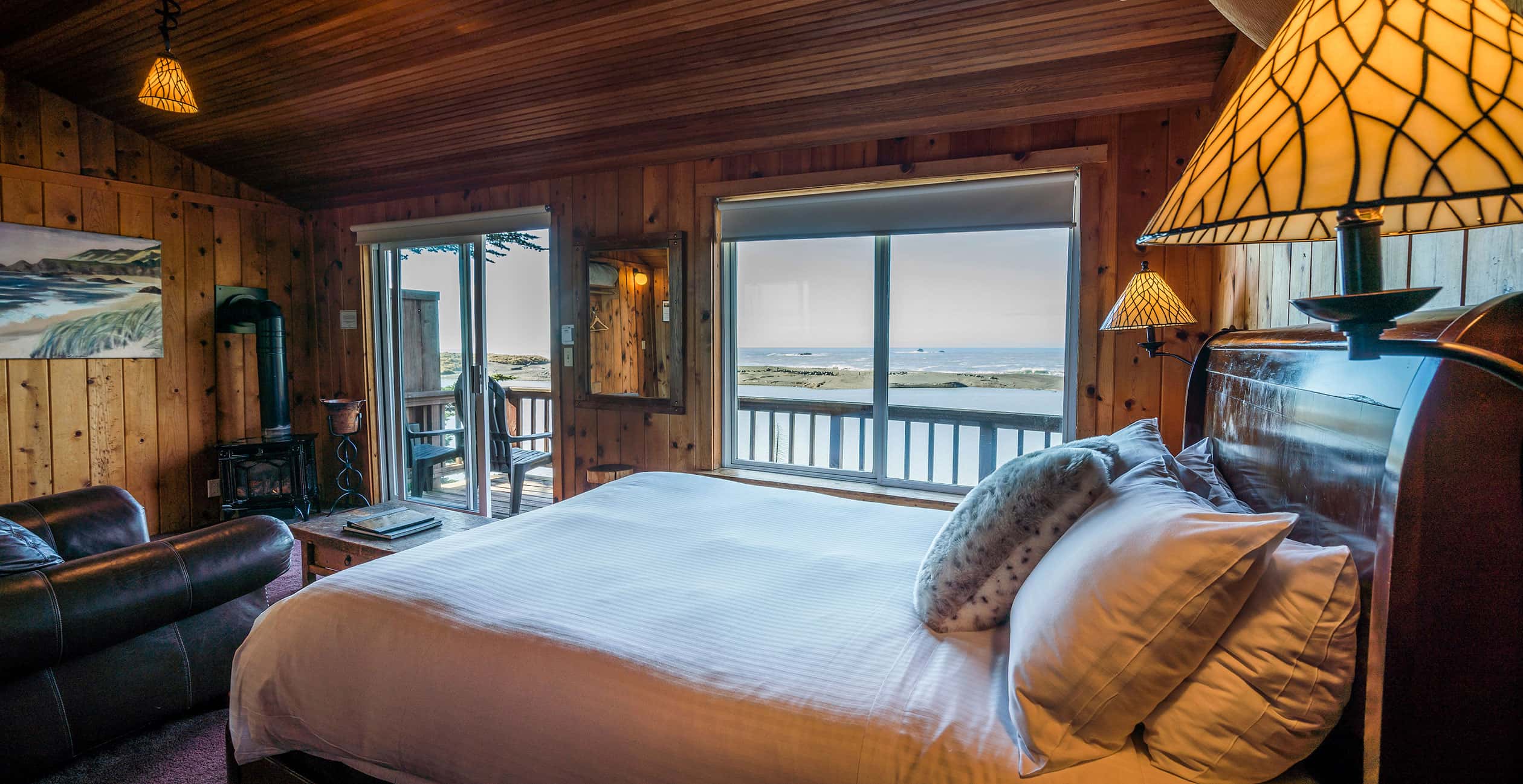 Cabin 2 bed across from windows with ocean view