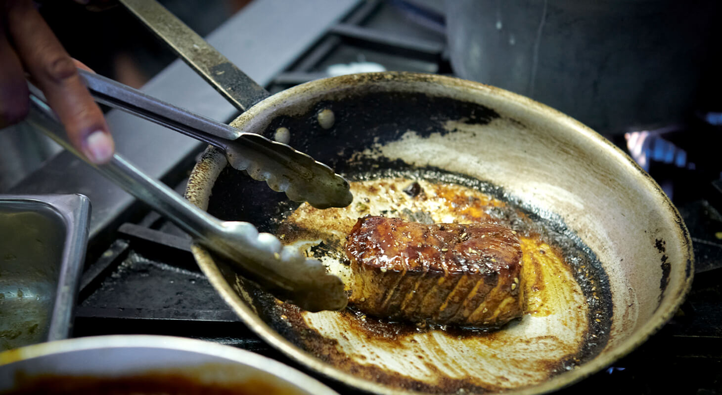 Chef cooking Kicking Ahi at River's End Restaurant